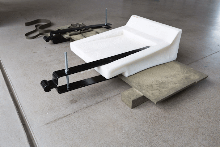 abstract sculpture of resin, concrete, leather, metal