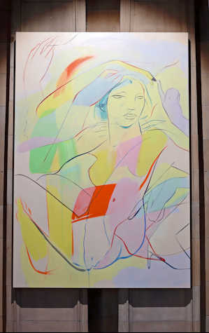 a large scale canvas hangs on a stone column. Fast lines depict a figure seated and turned back towards us, their arms raised, they look out past us. Blocks of yellow, pale pink, blue, green and red are layered through