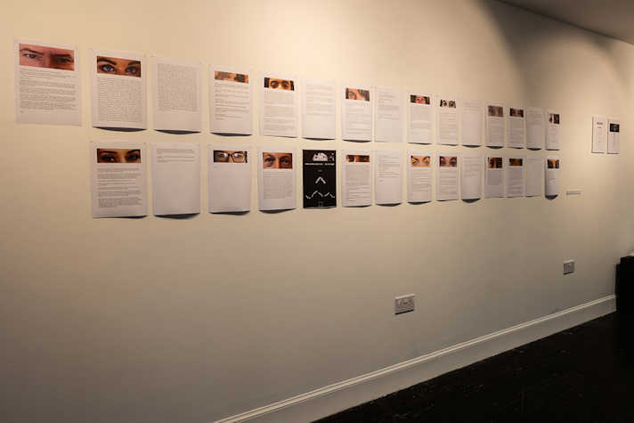 A4 sized artworks are displayed on a white wall.