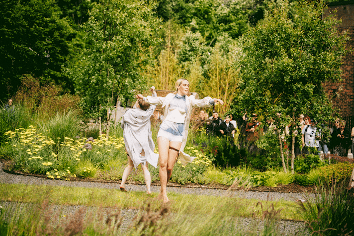 Performers in a garden location