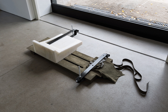 abstract sculpture of resin, concrete, leather, metal