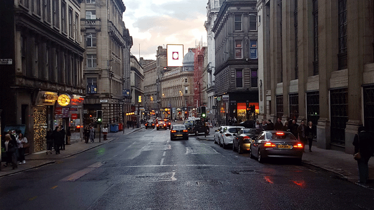  City scene with advertising screen in the distance
