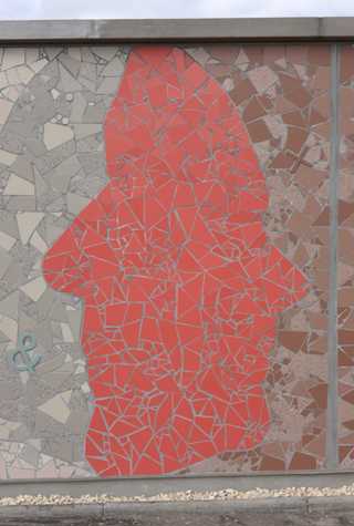 detail of a mosaic dual sided profile in a soft red