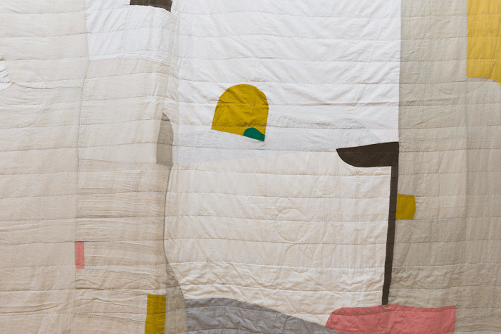 detail of large scale quilt with abstract cut out shapes