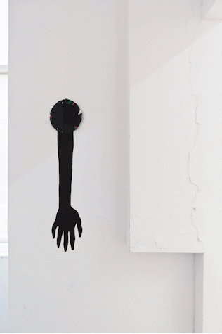 black fabric cut out of arm and hand
