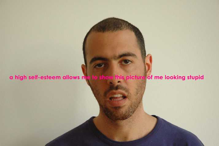 image of a person with their mouth slightly open. there is pink text overlayed onto the image that reads, 'a high self-esteem allows me to show this picture of me looking stupid'