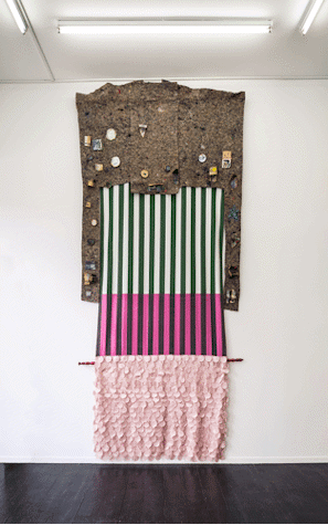 The image shows an artwork made of a patchwork of fabrics