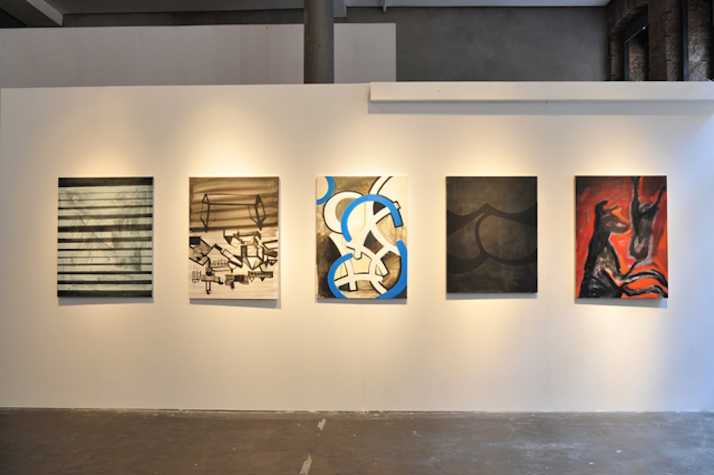 5 artworks in a row on a wall