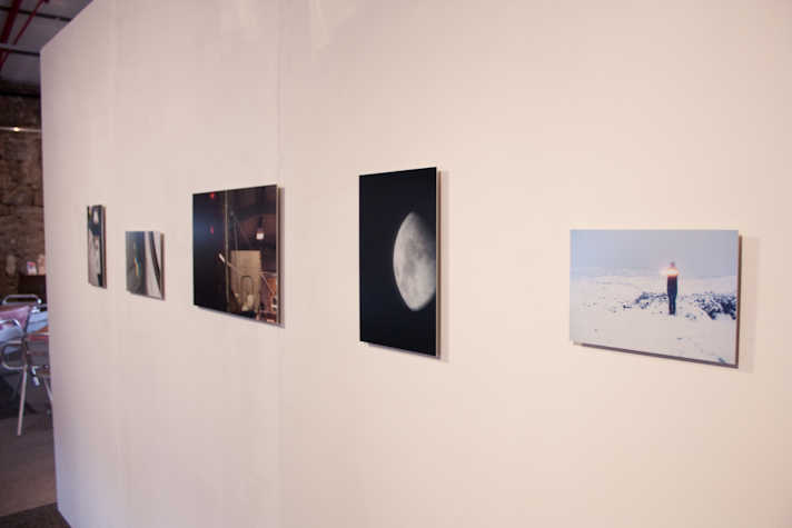 gallery wall with five small photographs in a row