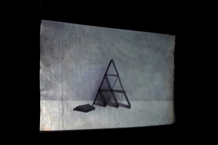 projected image of a tower of cards in a pyramid shape