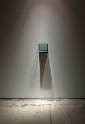 turquoise perspex box affixed to a wall