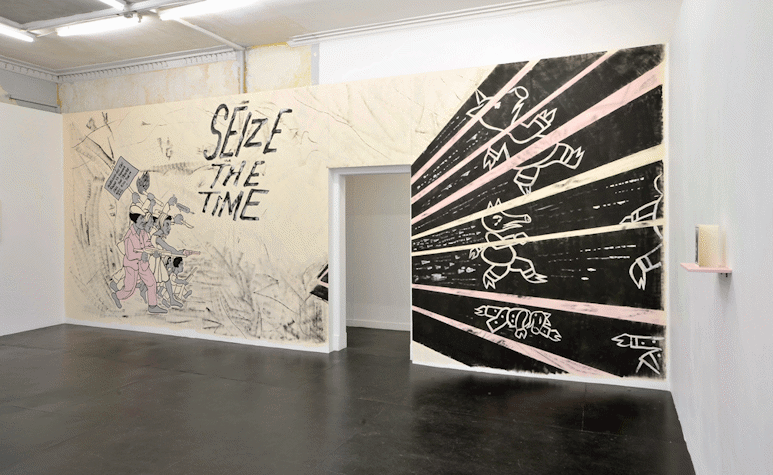 gallery with large mural on the wall. on the left side of the mural there are protesting adults and children holding guns. they hold a picket sign which reads, 'Alioto and his tag squad is gonna fall the people will kill them all.' 'SEIZE THE TIME' is written in large text. The right of the mural has simply illustrated pigs with lines streaking across them. one pig lays dead on the floor.