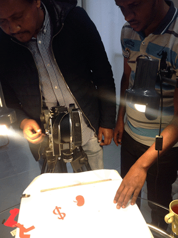 Close up of people using a 16mm camera
