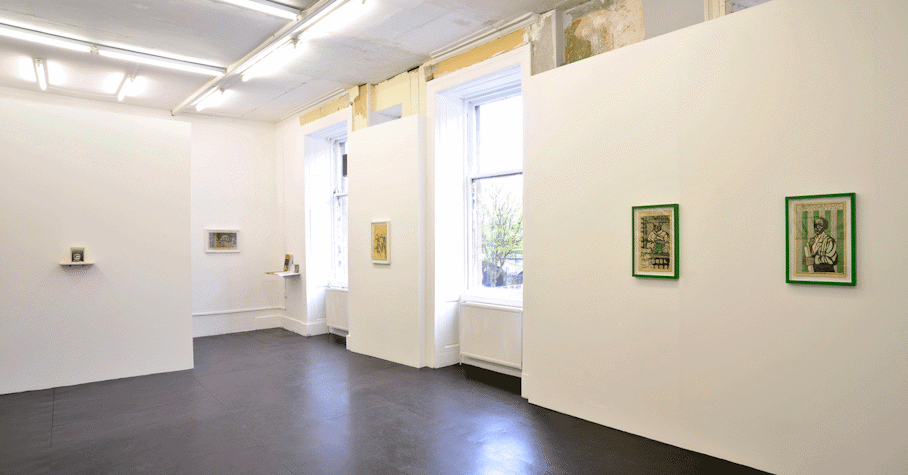 gallery space with various lithograph prints installed on the walls