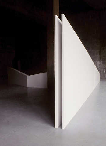 geometric triangular installation in a dark space