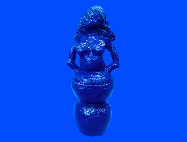 A photo of a sculpture of a woman's head and torso. The sculpture has curly hair and is painted blue.