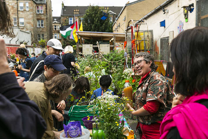 A group of people attending an event in a garden