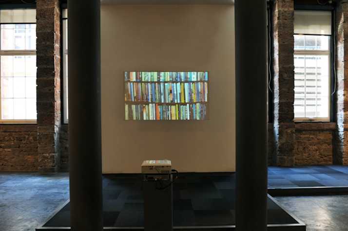 books on a bookshelf projected onto a wall