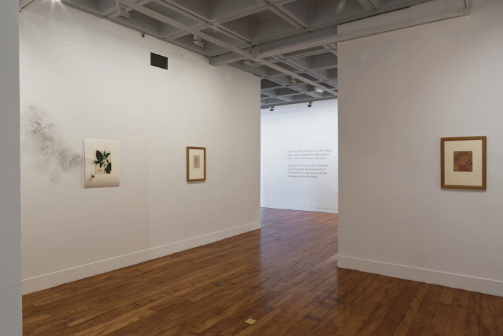 3 artworks on the walls of a gallery, 2 framed, 1 unframed.