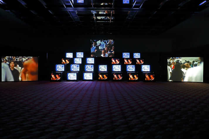 Pile of multiple cube monitors showing film