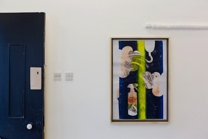 Paintings and ceramics in a small room