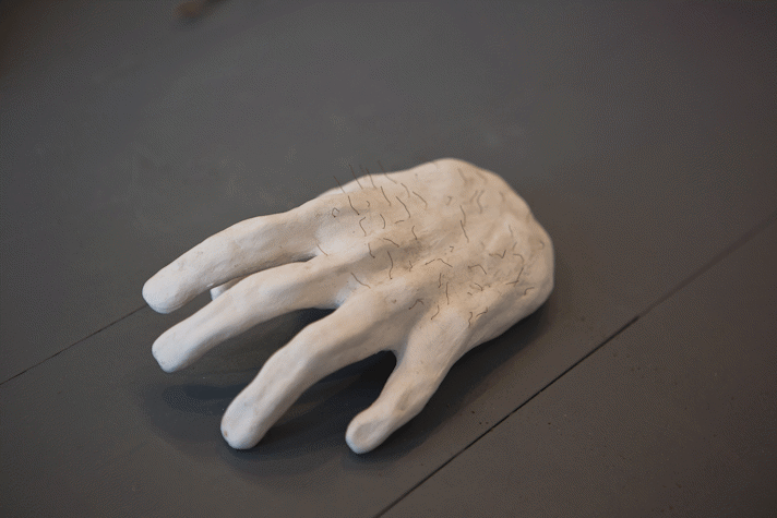 hand like sculpture on a gallery floor