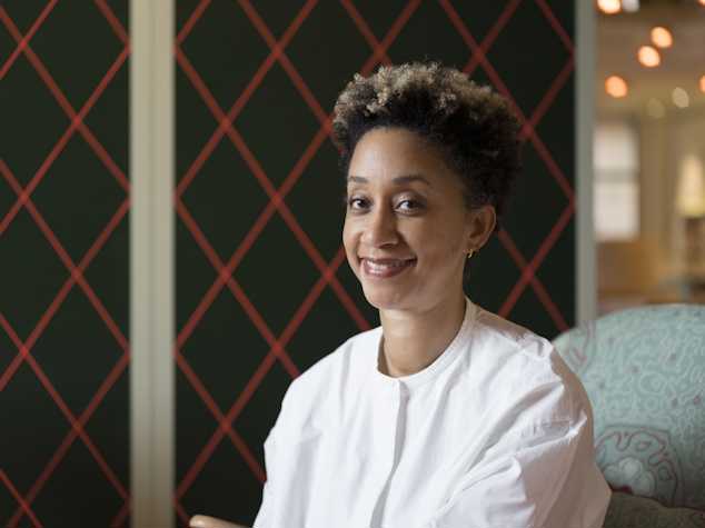 Portrait of Melanie Keen sat smiling