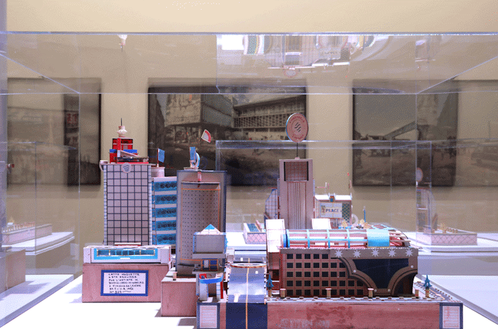 Installation view, photographs from the series Urban Now and sculptures of imagined buildings