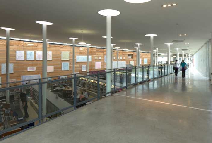 interior of platform gallery showing an exhibition wall in the background