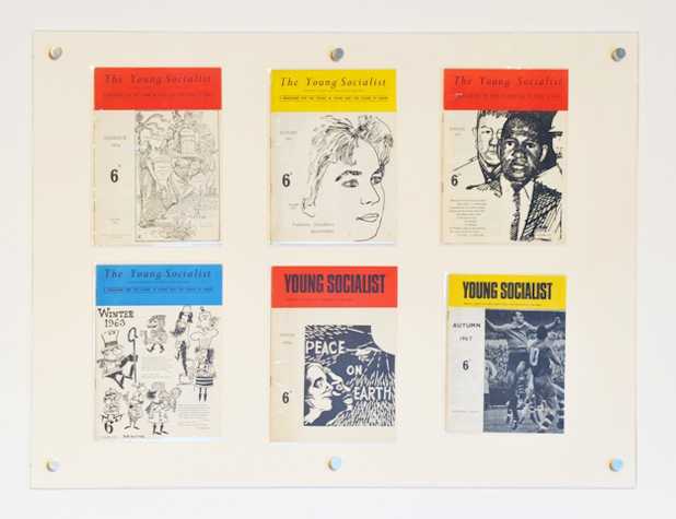 6 covers of "the young socialist" displayed on a wall.