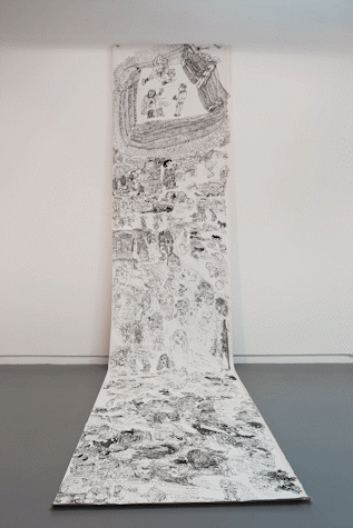 an intricate pen drawing on a long sheet of paper drapes from the wall down across a gallery floor